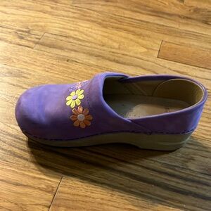 purple dansko clogs, with flowers across the top